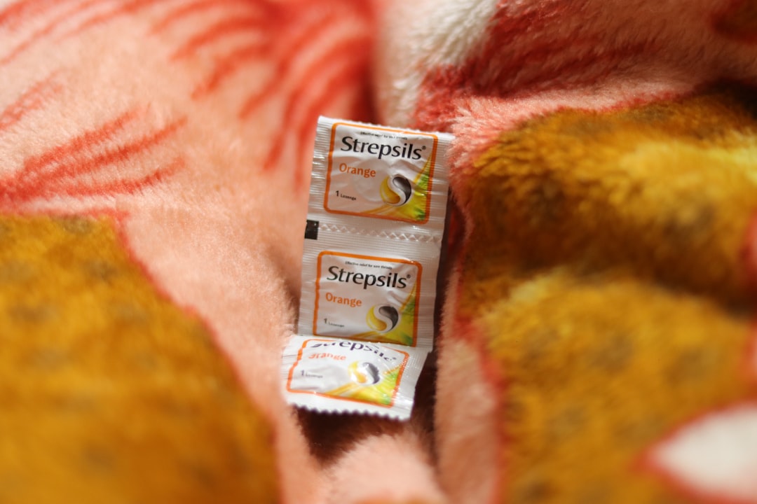 a couple of packets of soap sitting on top of a bed