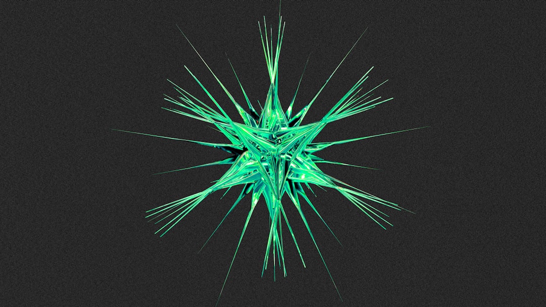 Green starburst-like structure against dark background.