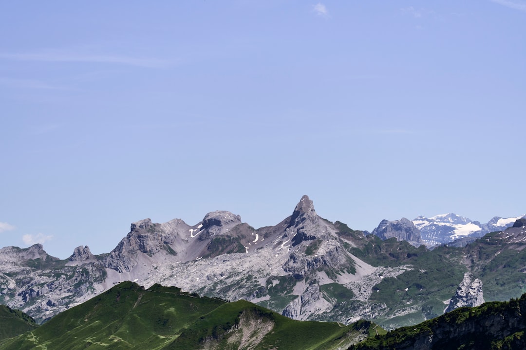 Jagged mountain peaks under a clear blue sky